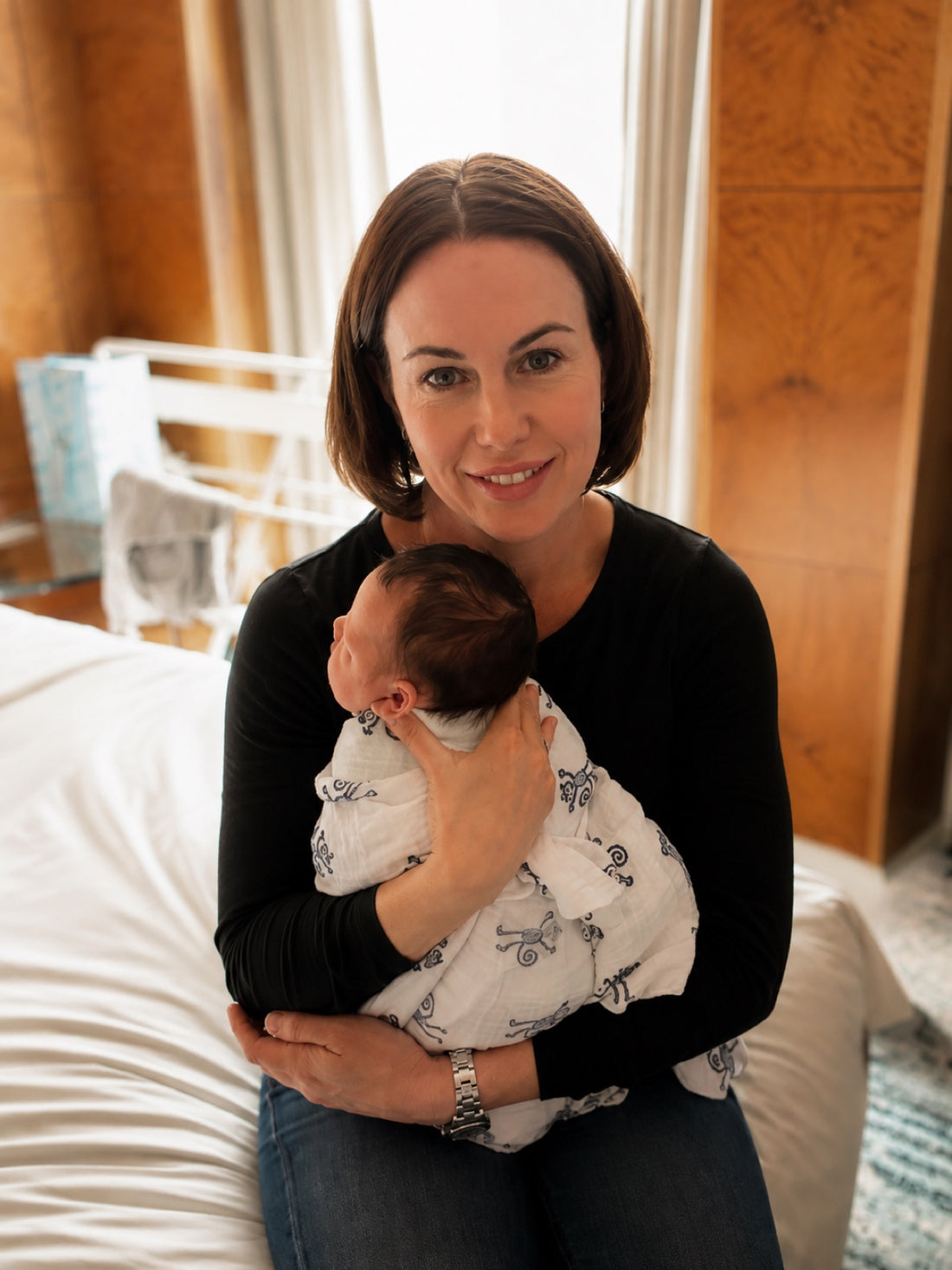 Alison holding a newborn baby