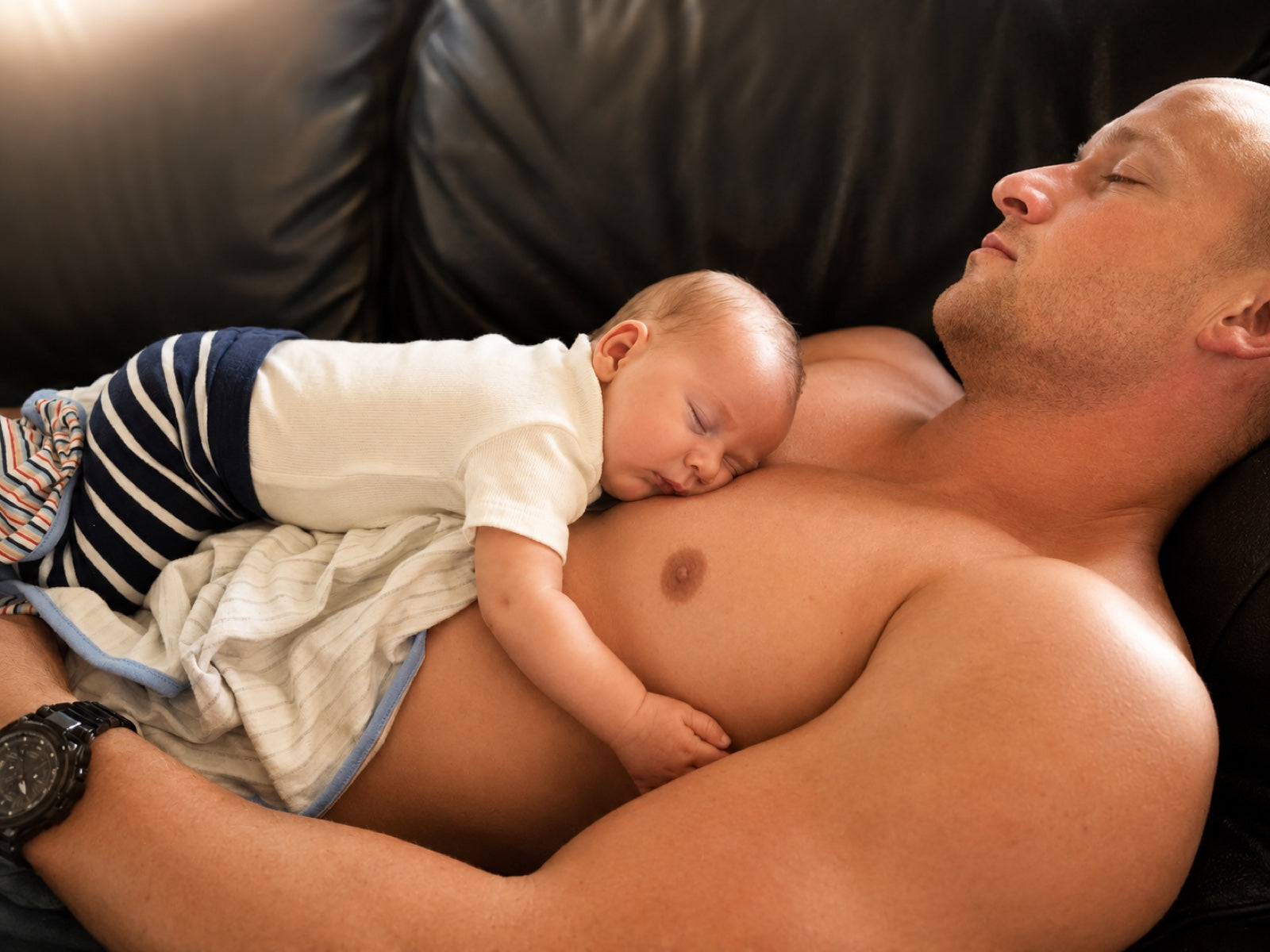 Baby contact-sleeping on a parent's chest