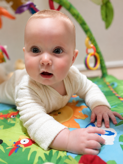An alert, curious baby during tummy time